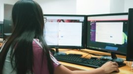 woman using desktop computer